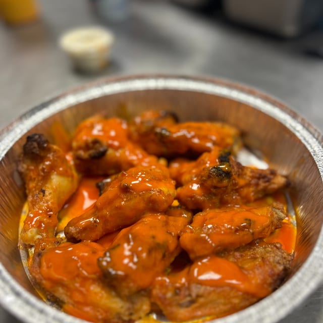 Baked Jumbo Sized Wings (10) - Lightly Breaded.